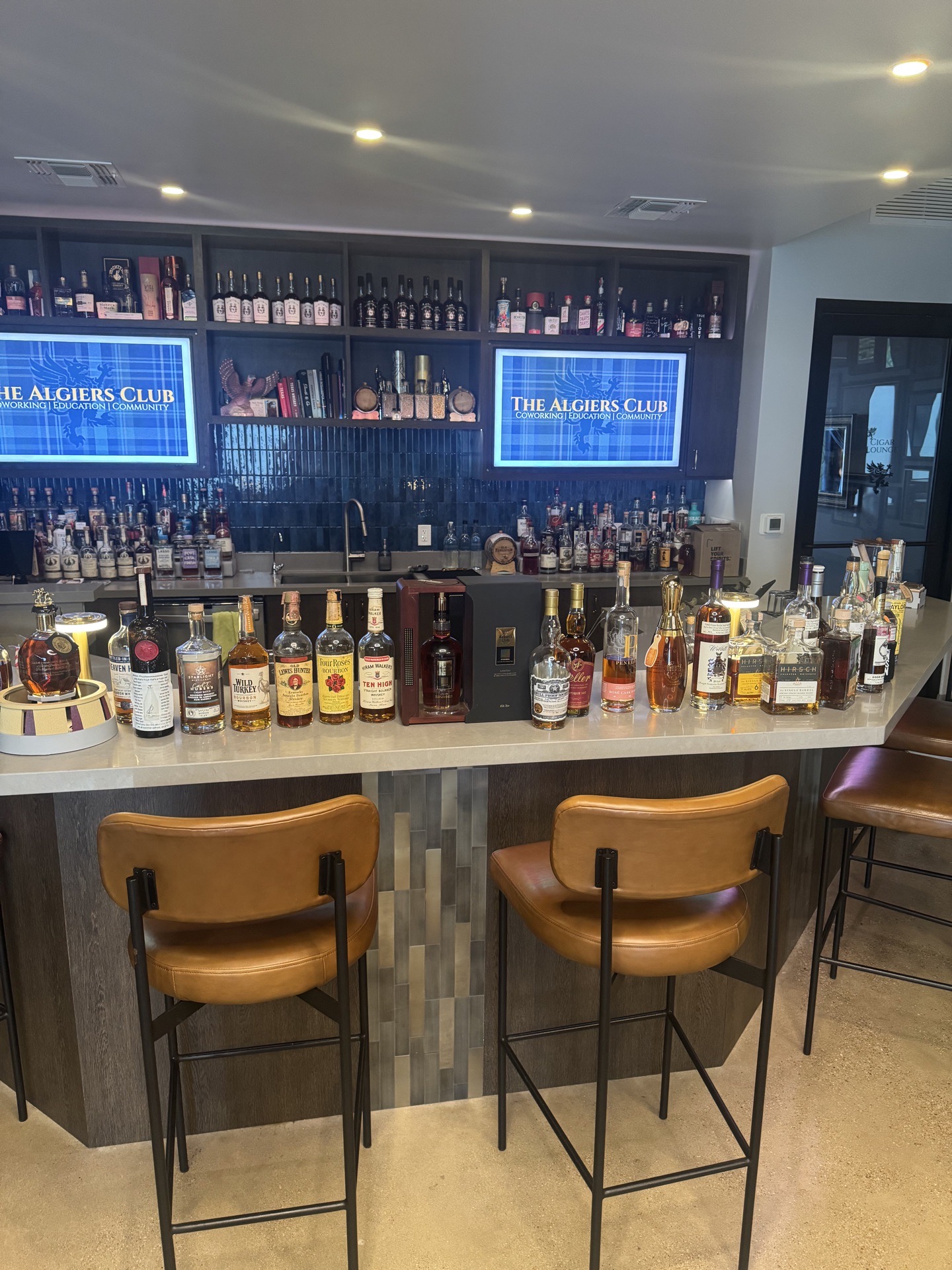 Wide shot of the Algiers Club bar during a Full Proof Society gathering